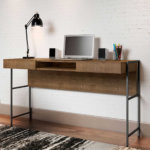 54" Industrial Desk made of wood and steel black legs with 2 drawers and 1 open storage area in a studio